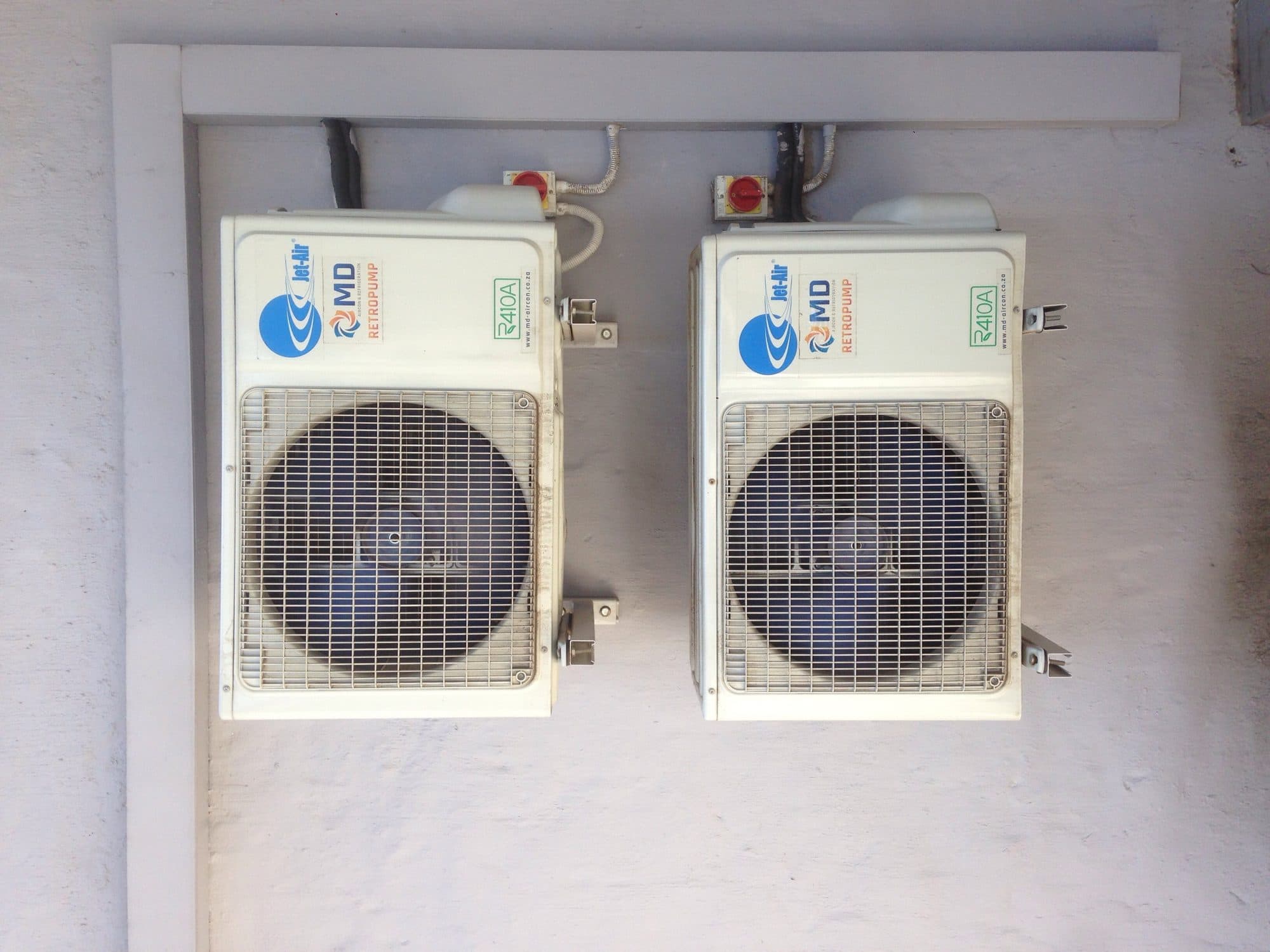 Two outdoor air conditioning units installed by Panwell